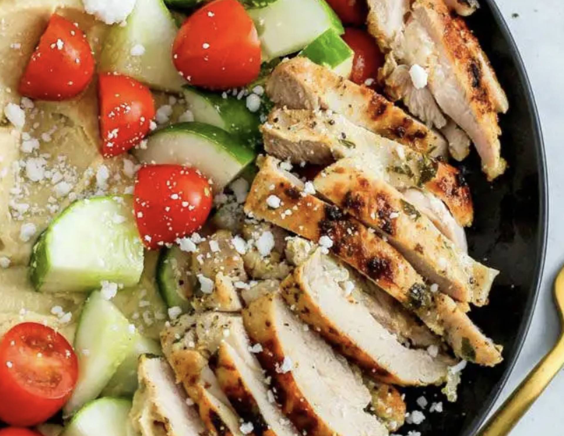 Herby Hummus Bowl with Grilled Bell & Evans Chicken Breast and Tomato Cucumber Salad (GF)