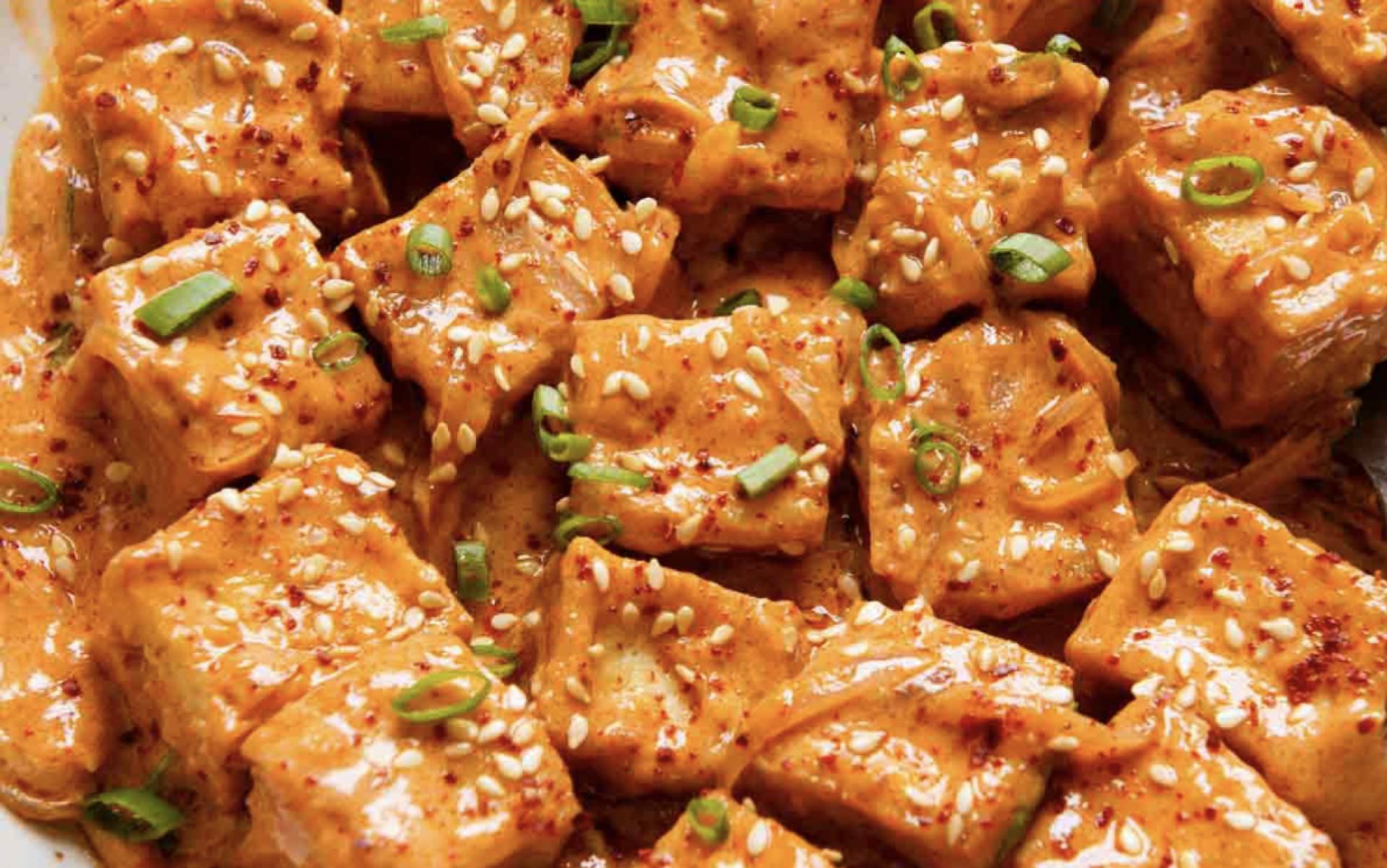 Creamy Coconut Curry Tofu over Rice with Tomato and Herbs. (GF/DF)