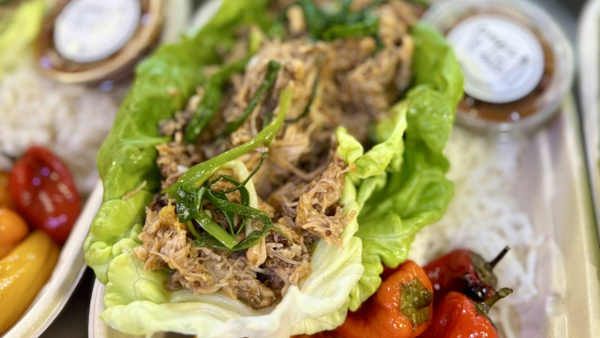 Asian Boozy Pig Pasture Raised Pulled Pork Lettuce Cups with GF Soy, Almonds, Green Onions, Basil and Chile Peppers (A little spicy)